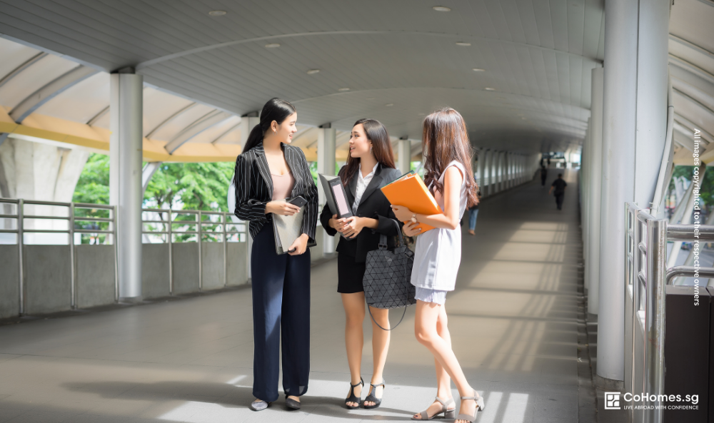 Working professionals discussing flexible rental options in Singapore