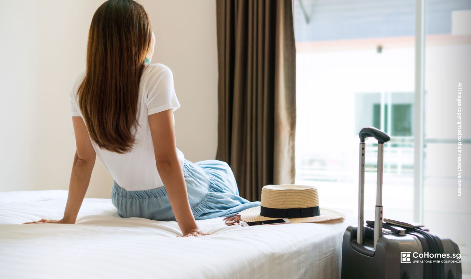 Young woman sitting on a bed in a new room, preparing for her first move and independent living