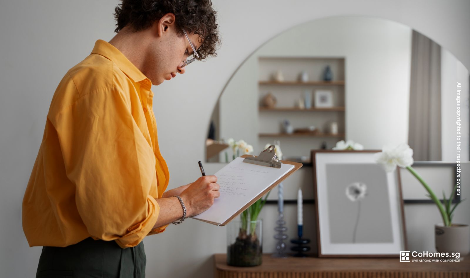 Person using a checklist to evaluate a rental property during a house tour